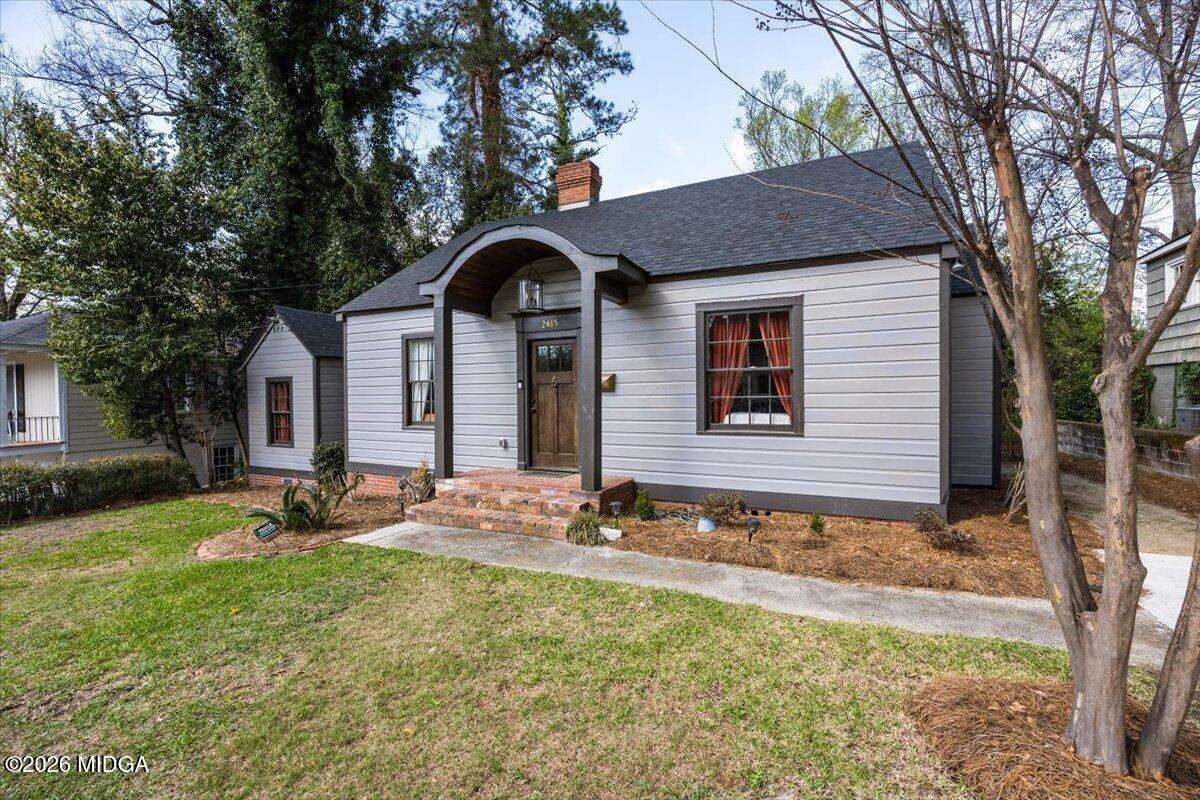 Front exterior of renovated Midtown Macon home at 2485 Carlton Way with walkway to front door.
