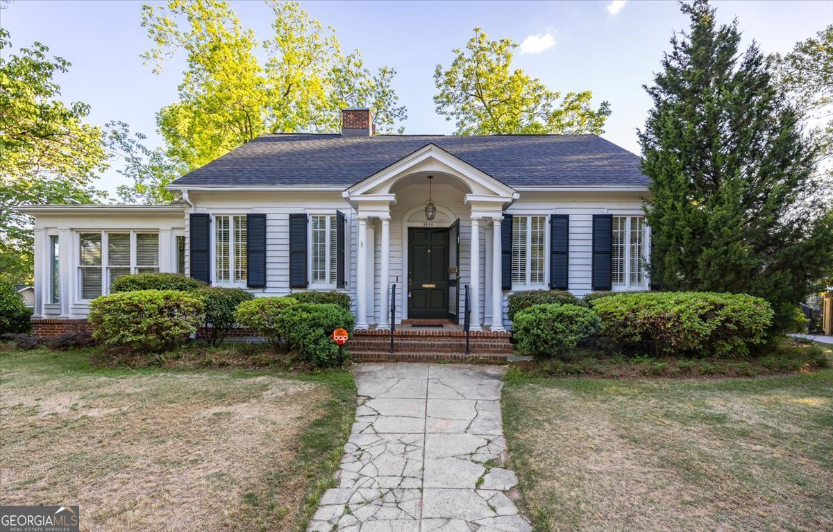Front view of absolutely charming Midtown home perched at the top of Vista