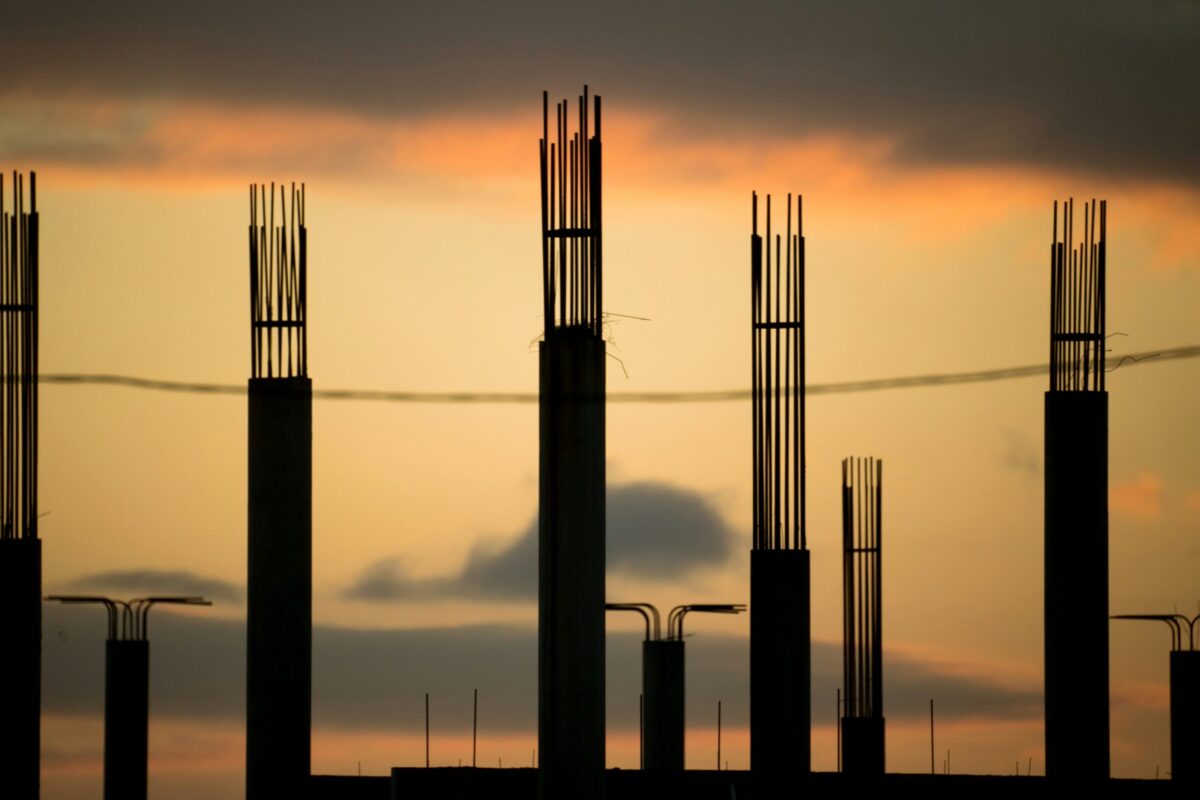 Construction cranes and structural columns representing growth and the future of Macon real estate development in Middle Georgia