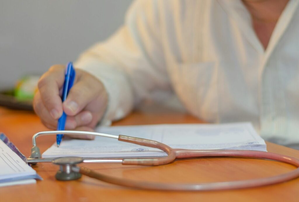 Physician Housing in Middle Georgia | Doctor Relocation to Macon - Joanna "JoJo" Jones Physician completing paperwork before relocating to Middle Georgia and searching for housing near Macon hospitals