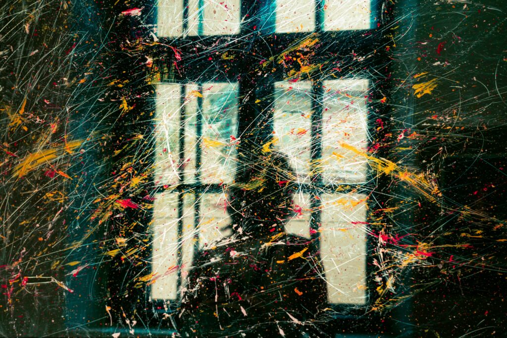 Abstract paint splatter artwork representing the costly mistakes and financial risks that can lead to losing money in real estate.