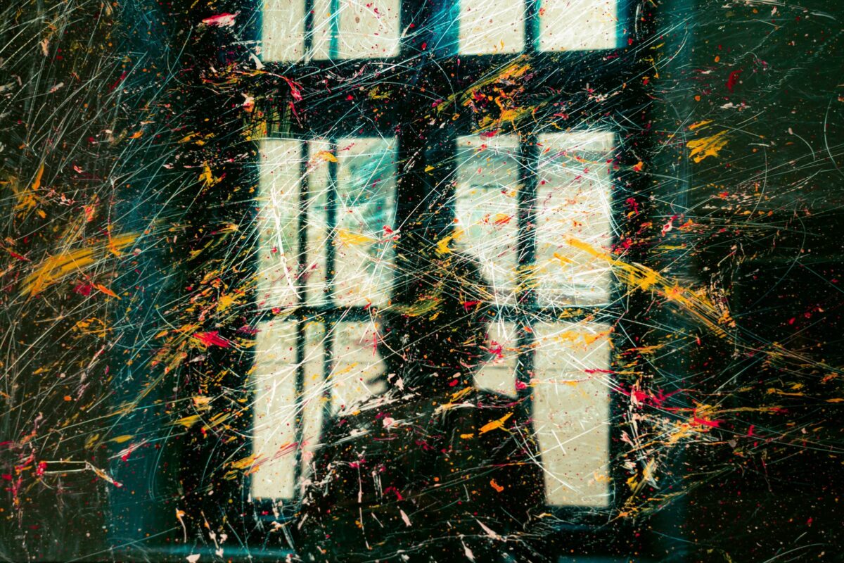 Common Real Estate Mistakes That Can Cost Buyers and Sellers Money - Joanna "JoJo" Jones - Joanna "JoJo" Jones Abstract paint splatter artwork representing the costly mistakes and financial risks that can lead to losing money in real estate.