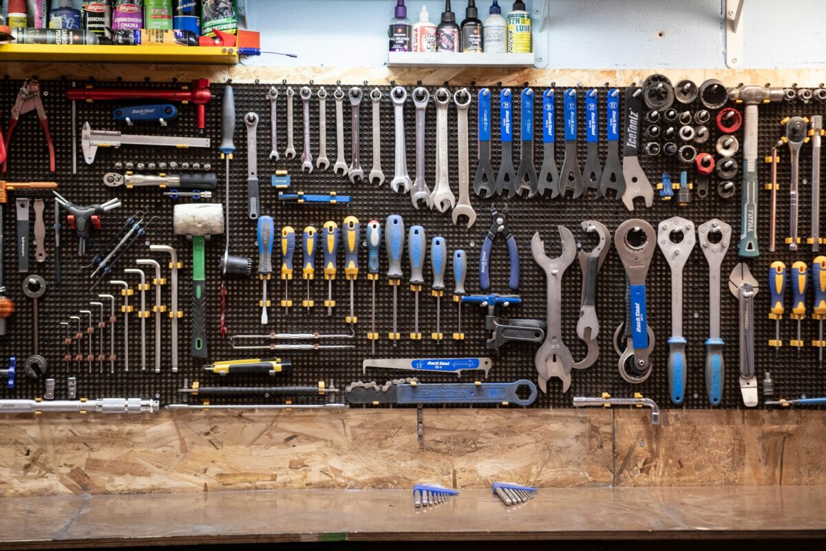 Organized garage workshop with neatly arranged hand tools and wrenches