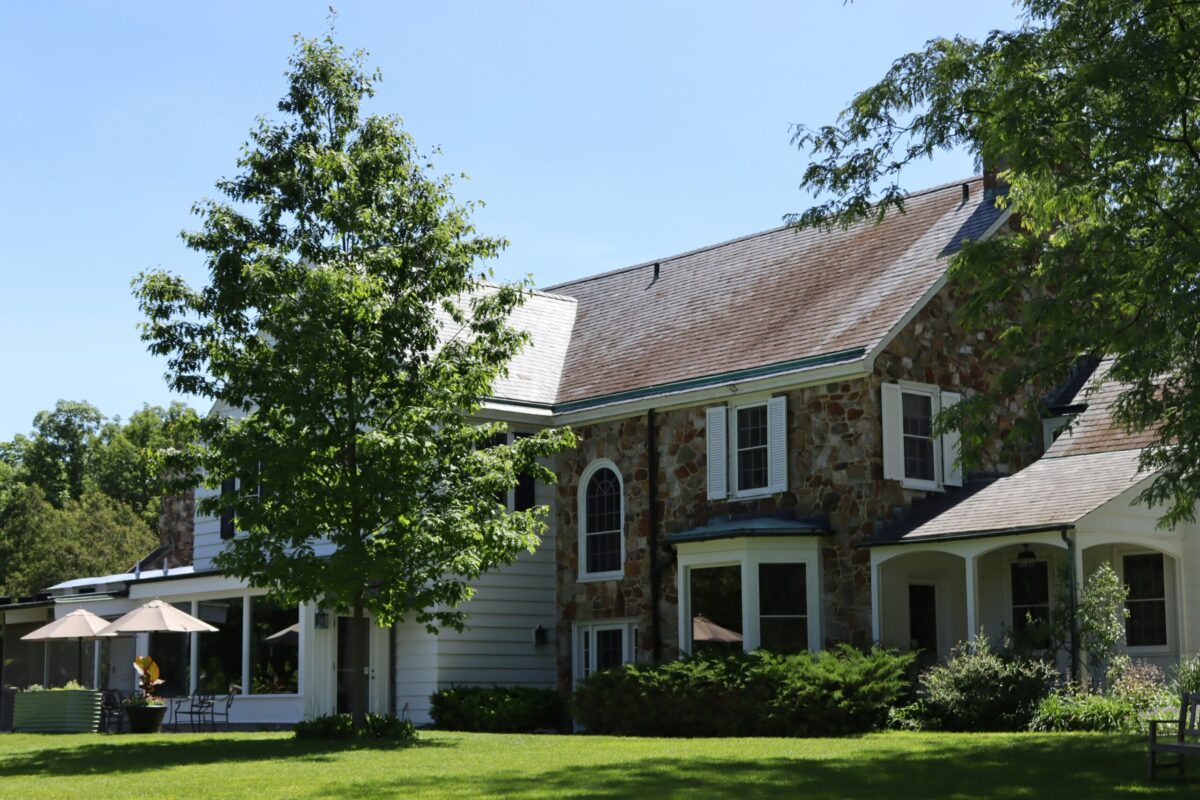 Should Zillow Choose My Agent? - Joanna "JoJo" Jones - Joanna "JoJo" Jones Stone home exterior for sale with professional real estate representation