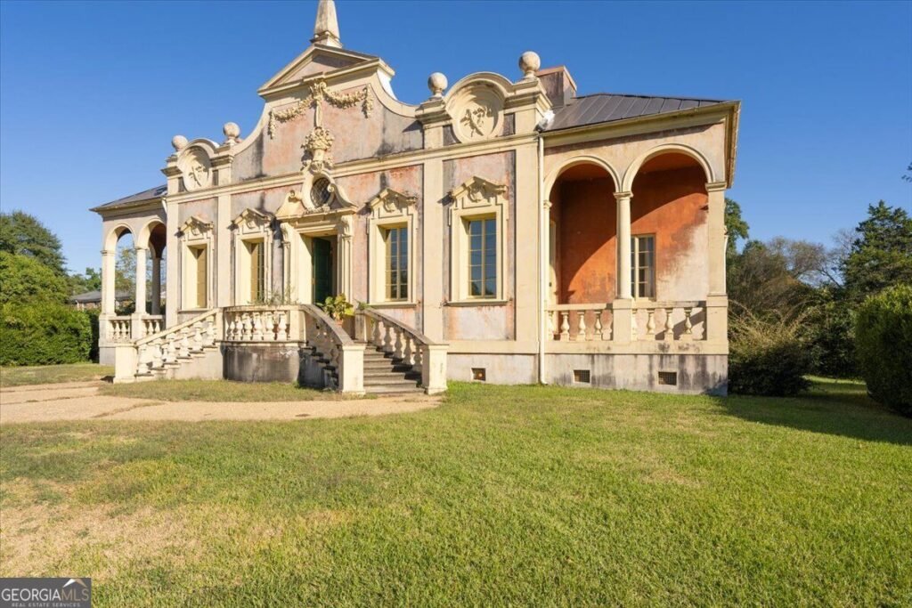 Villa Albicini at 150 Tucker Road in Macon GA, featuring an ornate Italian Baroque facade, arched porches and curved entrance steps.