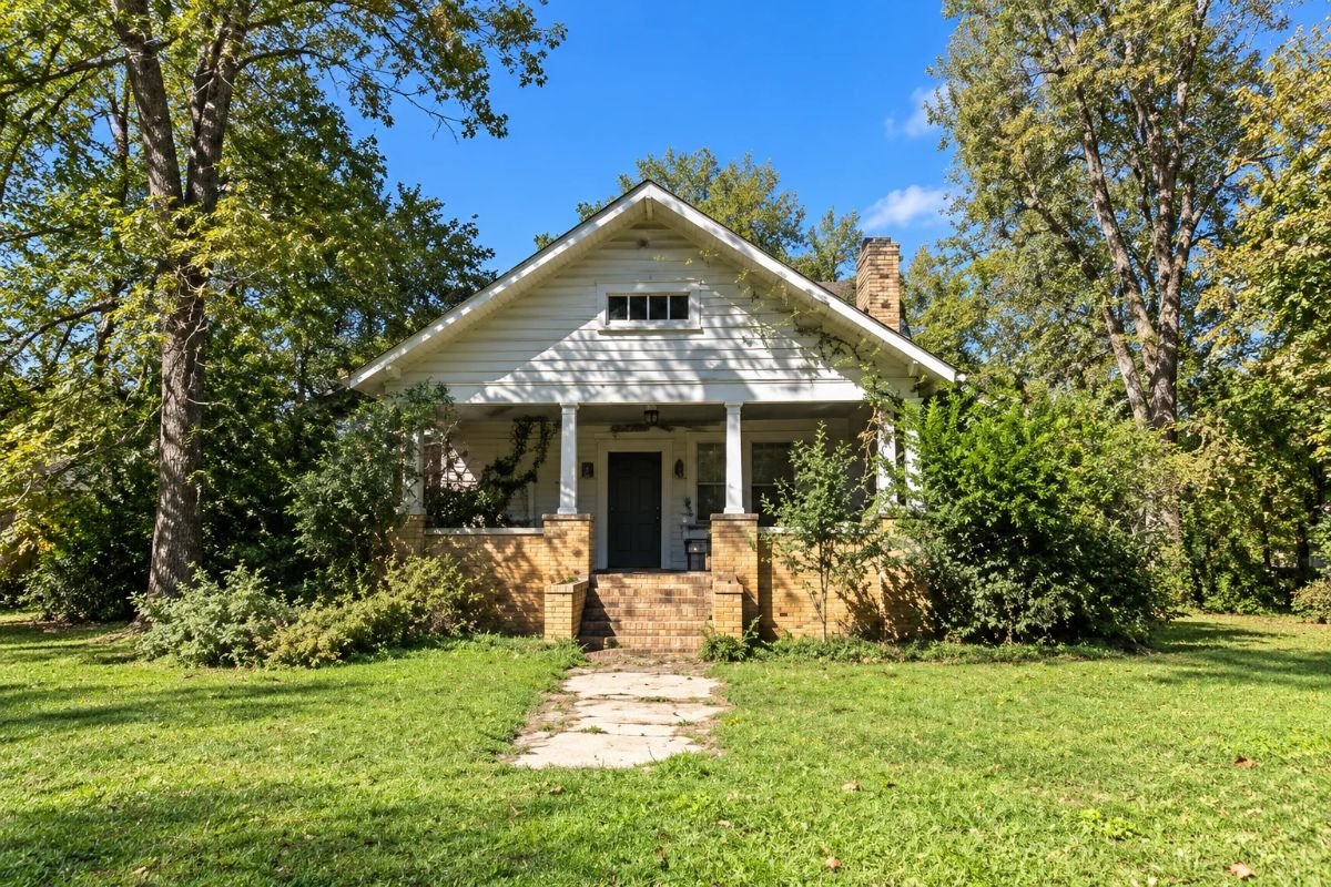 166 Hooks Street Gordon GA Home for Sale | AI Generated - Joanna "JoJo" Jones - Joanna "JoJo" Jones AI Generated image of 166 Hooks Street in Gordon GA, showing a gabled home with a covered front porch, brick columns and a front walkway.