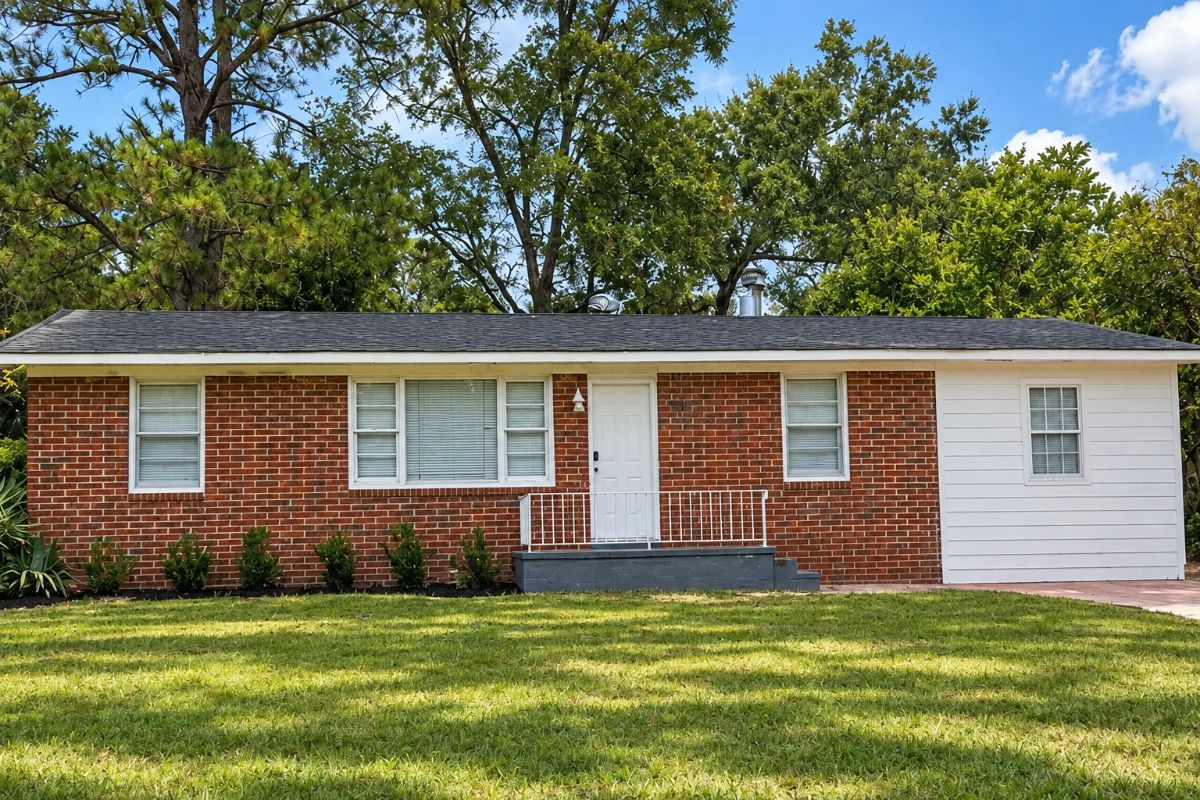 2869 Bonnie Avenue Macon GA | AI Enhanced Image - Joanna "JoJo" Jones - Joanna "JoJo" Jones AI Enhanced Image of the brick ranch at 2869 Bonnie Avenue in Macon GA, showing the front exterior, porch and lawn.